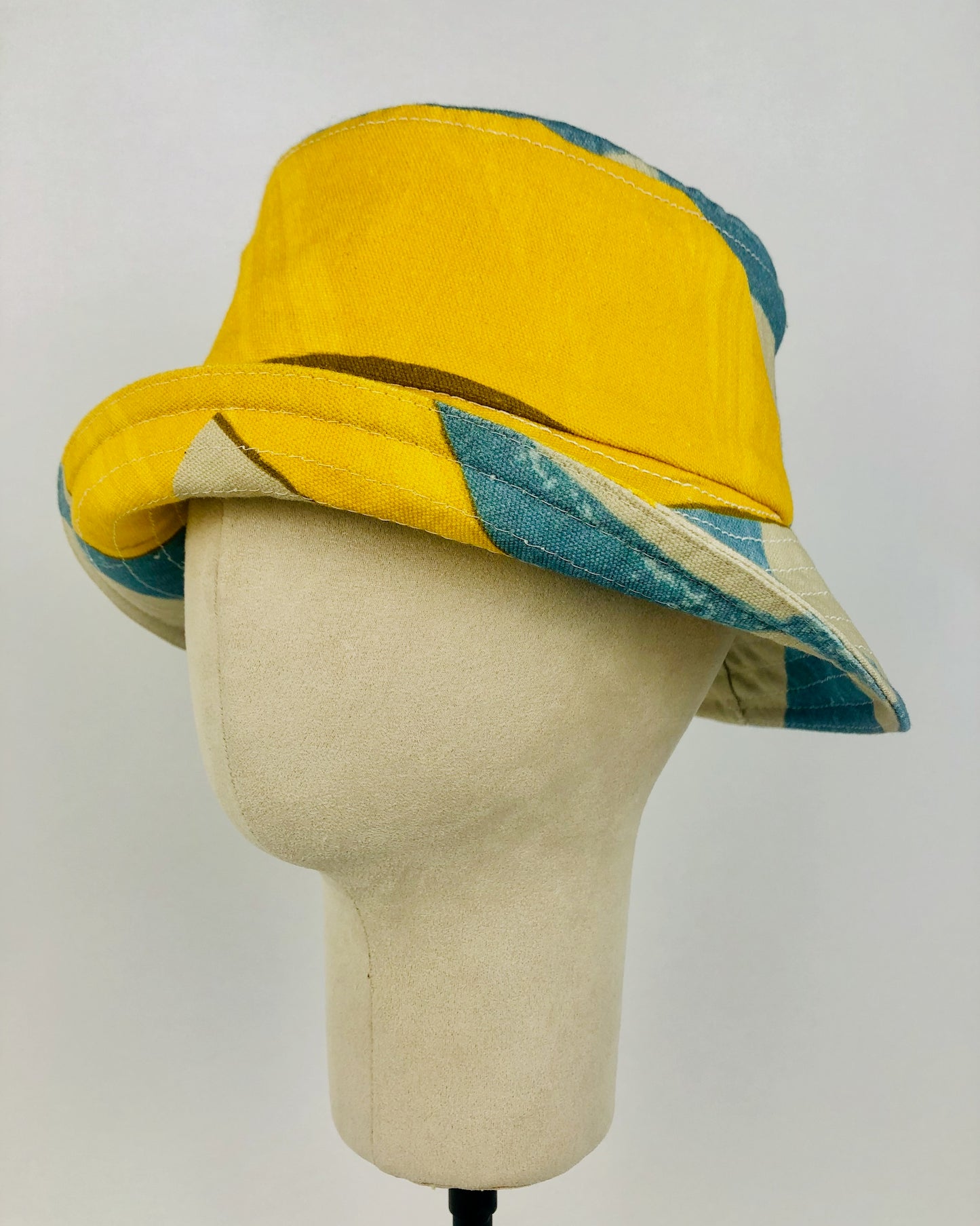 Cute yellow bucket hat with the brim flipped up