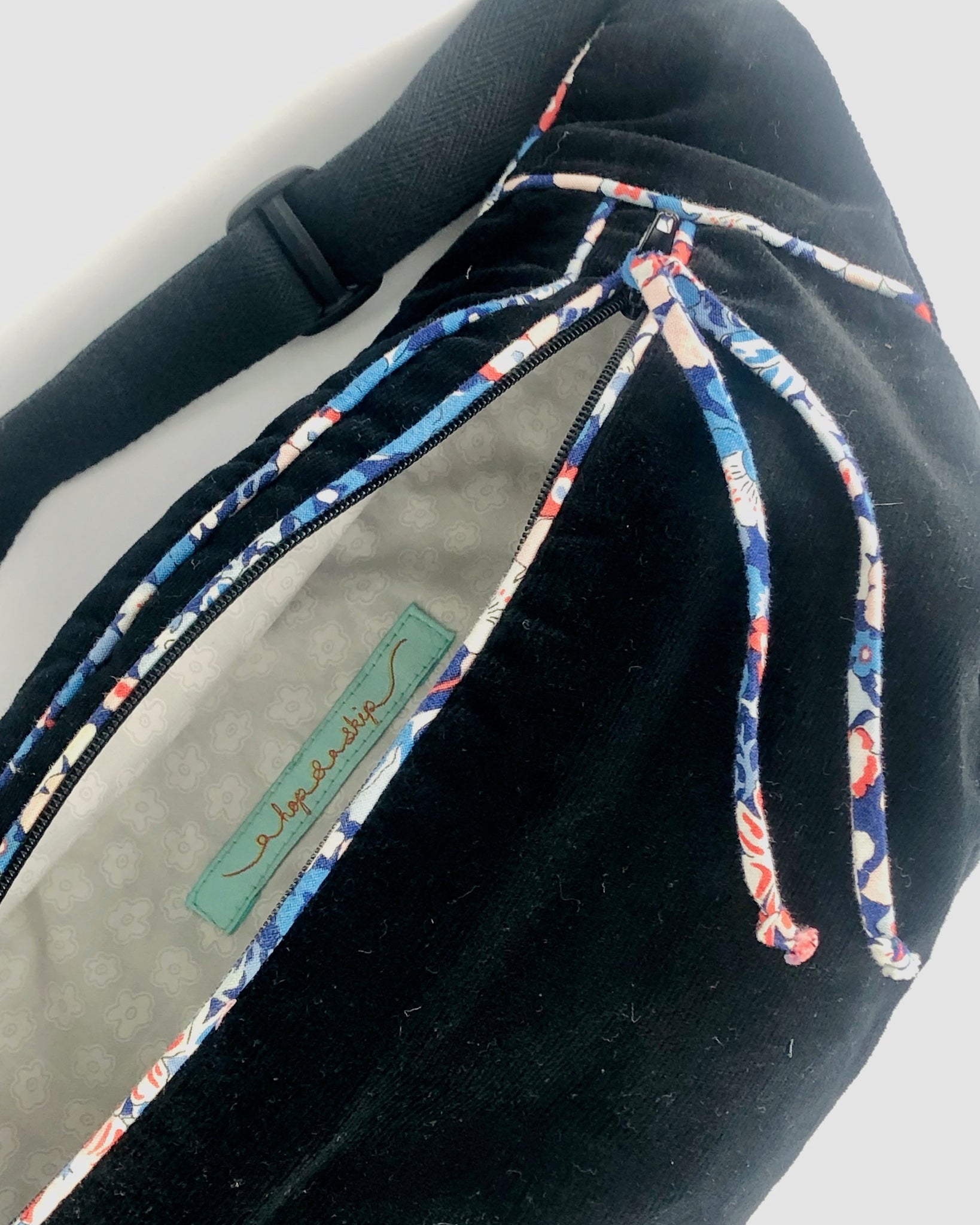 Interior compartment of hand crafted bumbag made from black corduroy