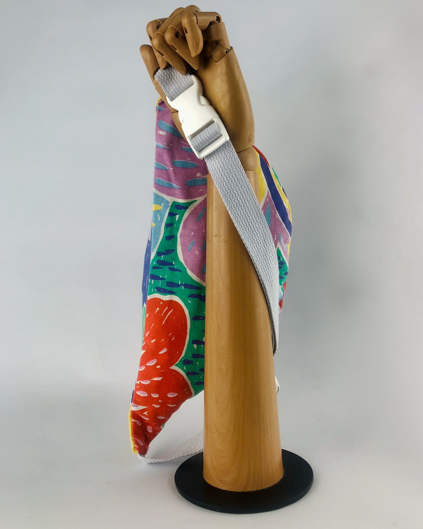 Bumbag made with fabric inspired by Ken Done designs with vibrant and bold flora in green, blue, pink and orange