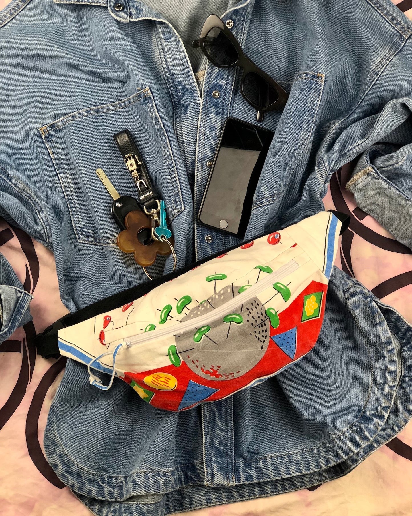 Flat lay of a bumbag made from vintage tea towel in a rare mid century print