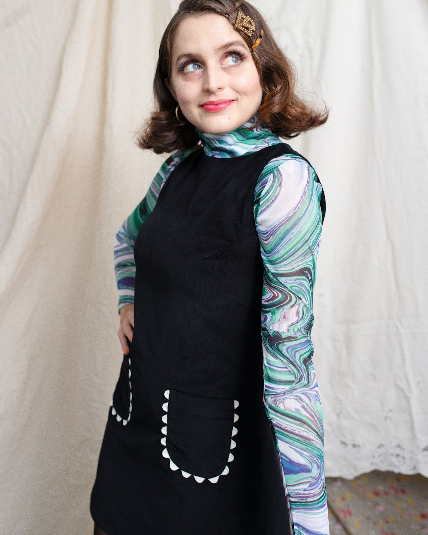 Sleeveless and Aline corduroy dress in black with little front patch pockets with cute off white ric rac ribbon