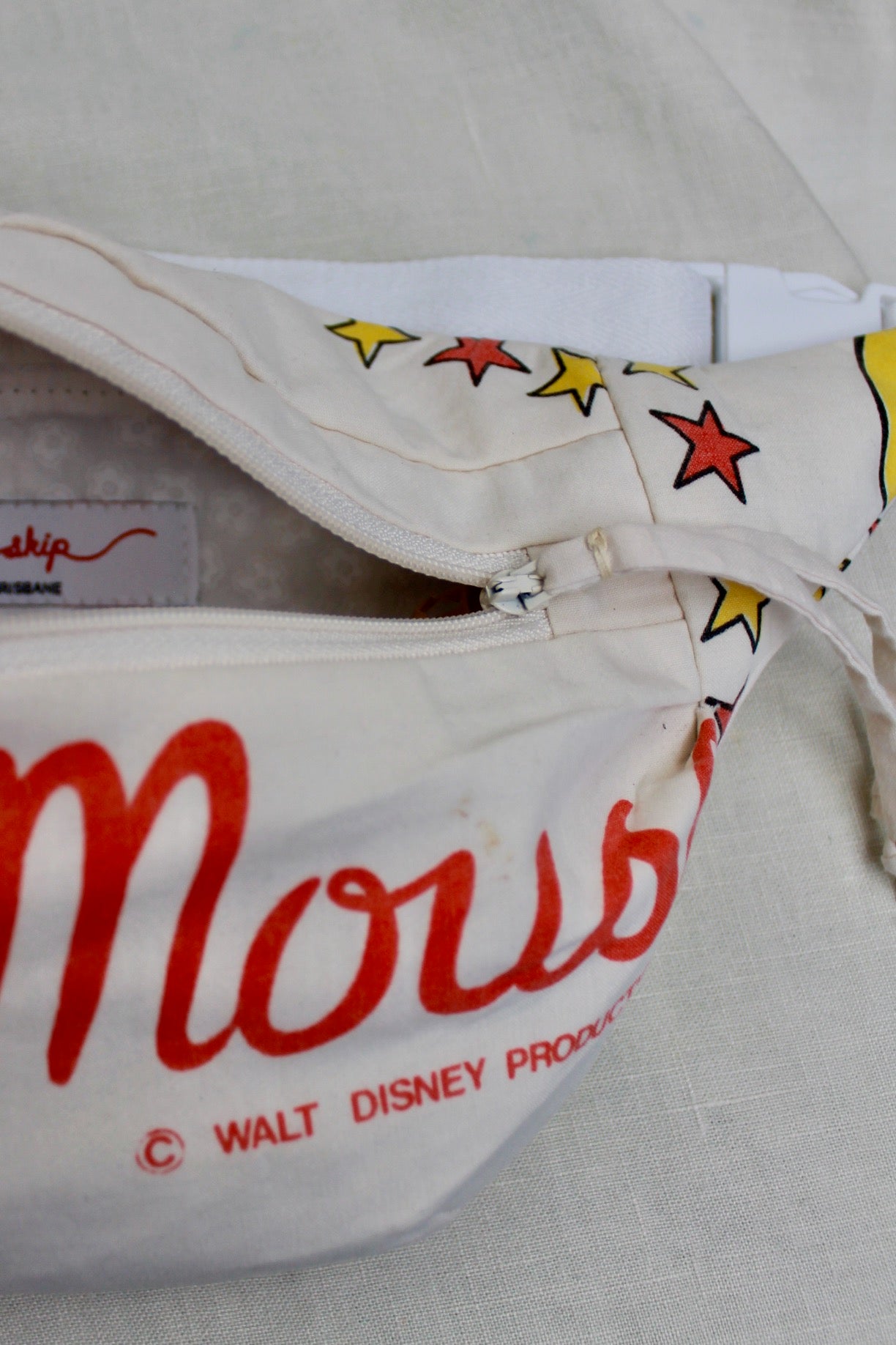 Close up detail of Mickey Mouse bumbag with the zipper open and showing the fully lined inside of the bumbag