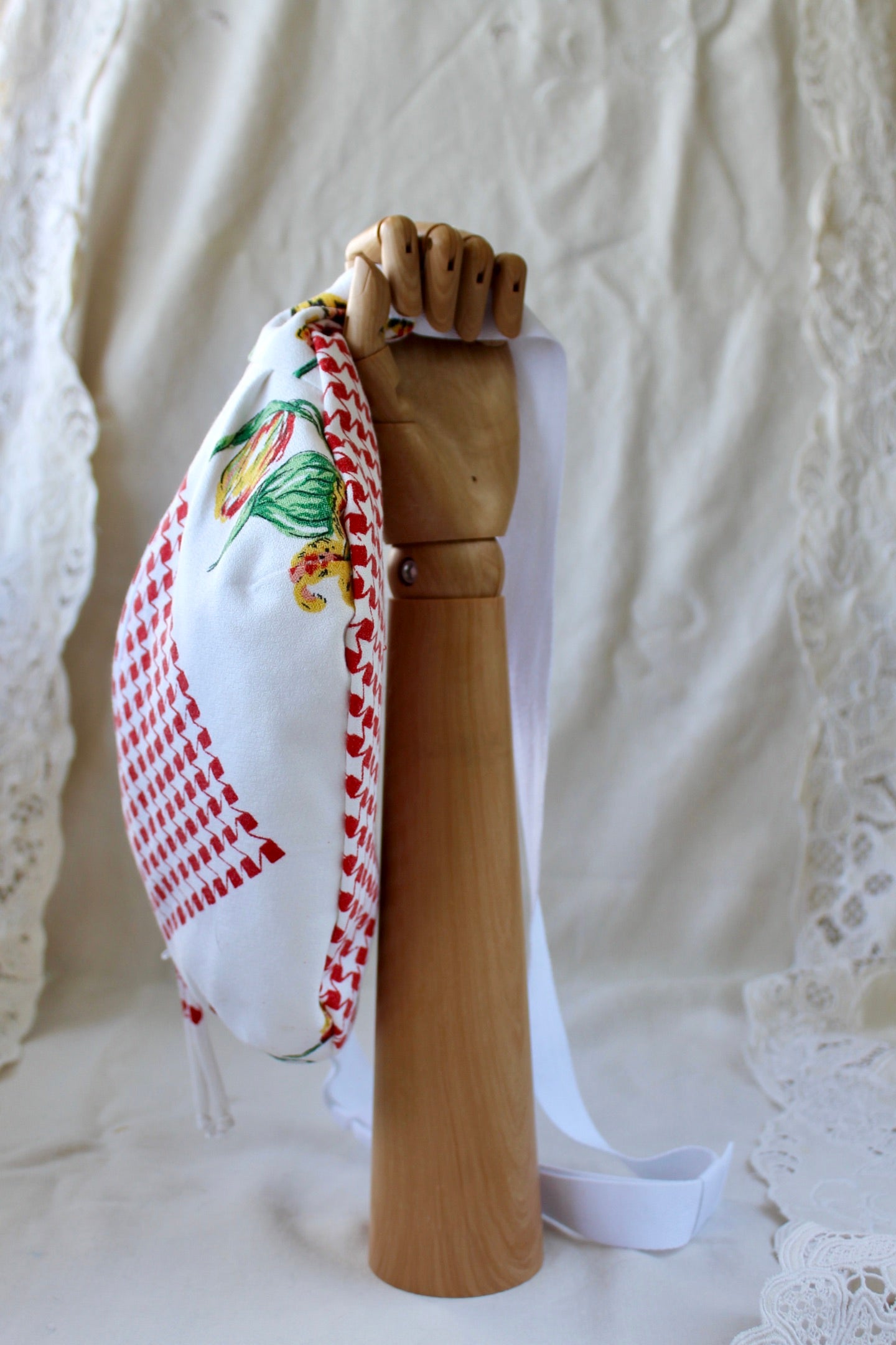 Bottom view of bumbag featuring a red and white houndstooth pattern