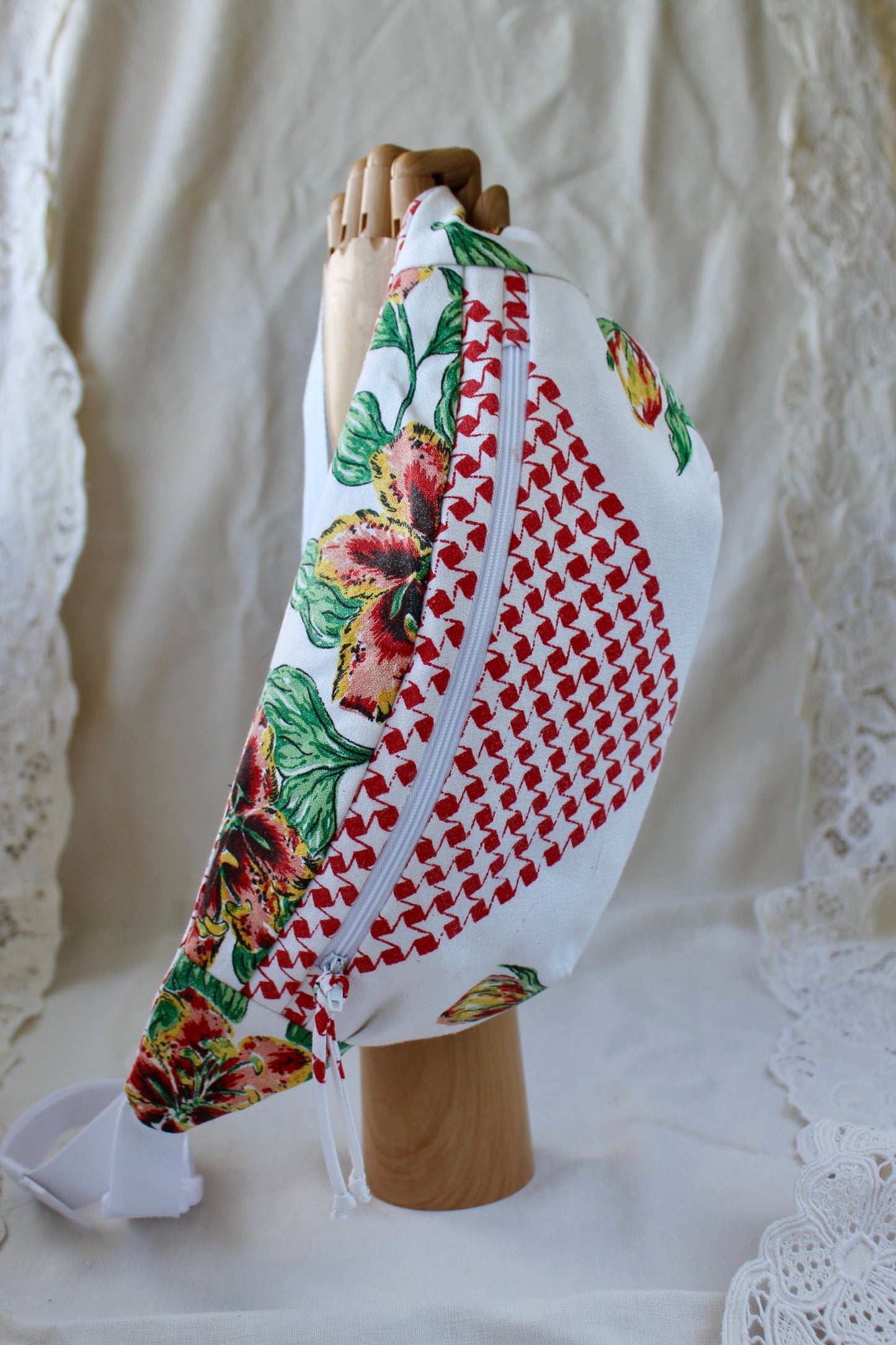 Front view of handmade fanny pack made from a mid century style tablecloth