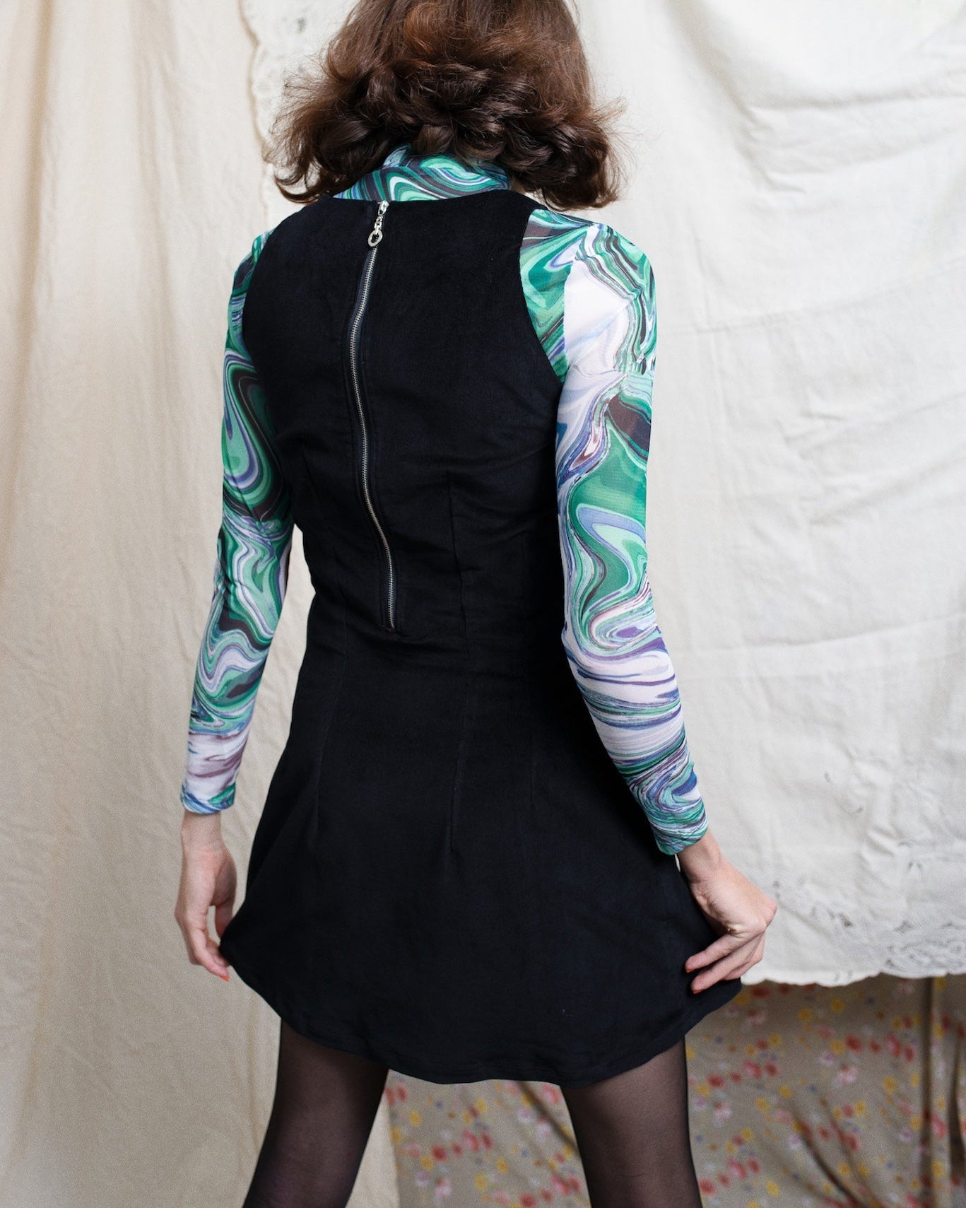 Back view of black corduroy A line shift pinafore dress