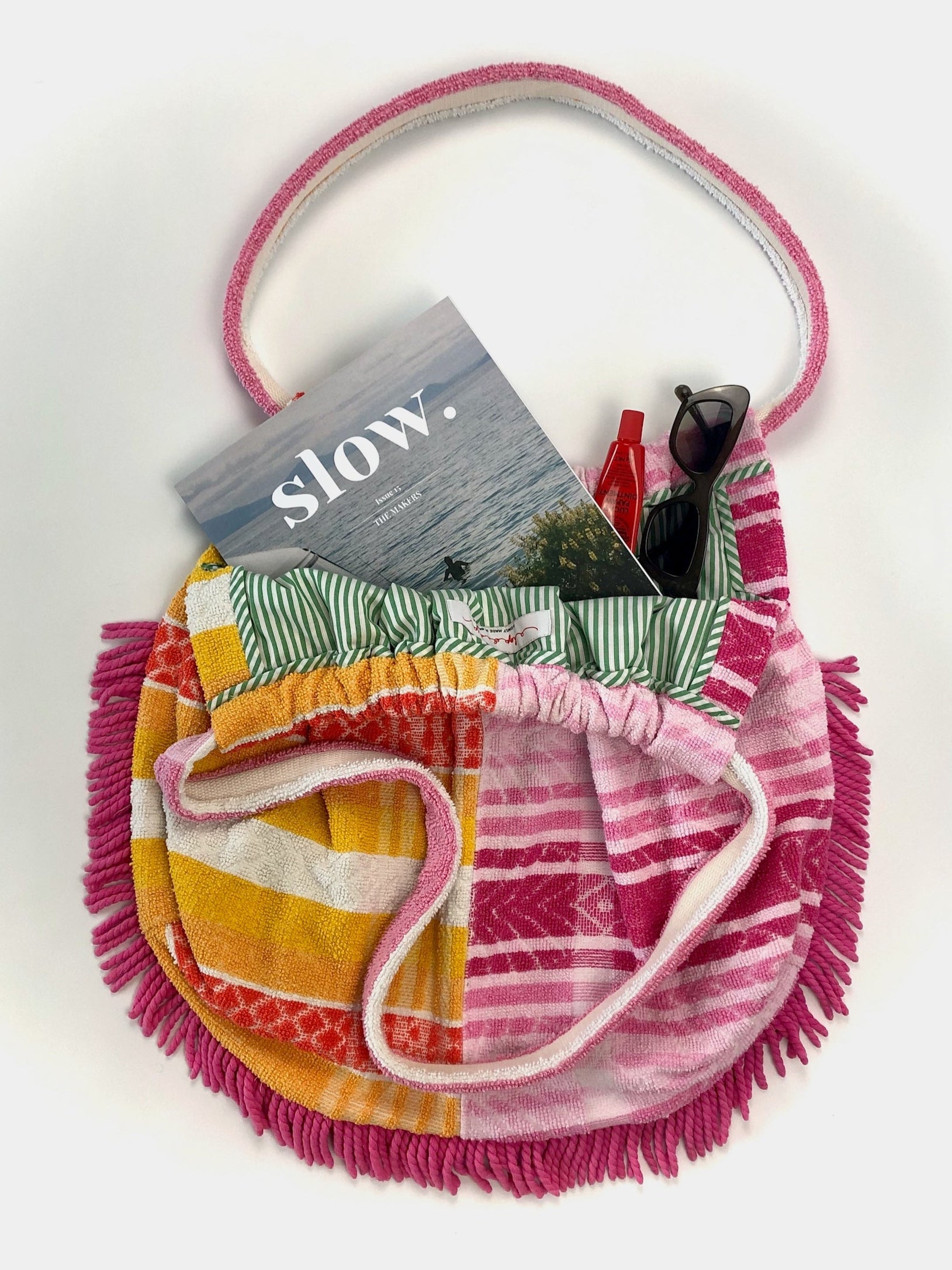 Ethically and locally made beach bag with magazine, lippy and sunglasses inside